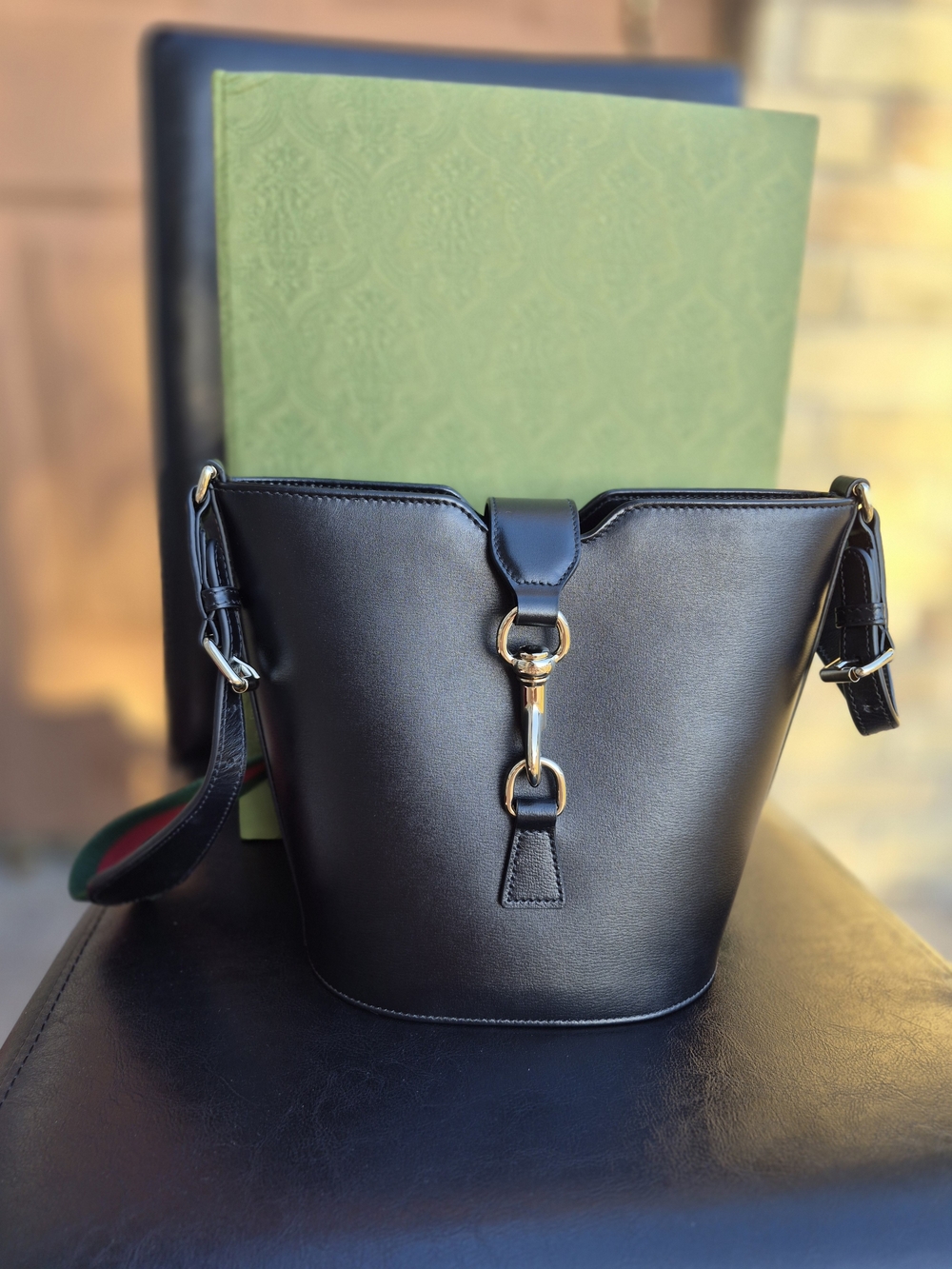 Black Leather Bucket Bag with Gold Hardware